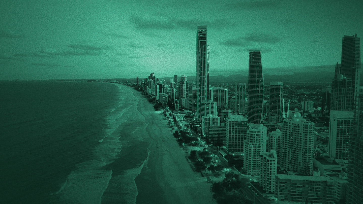 Aerial view of Gold Coast beach and high-rise skyline with a dark teal overlay