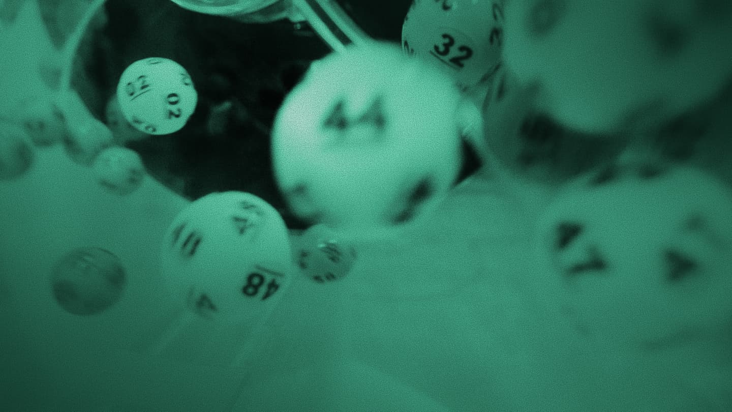 Numbered lottery balls tumbling in motion, grainy green-tinted photo