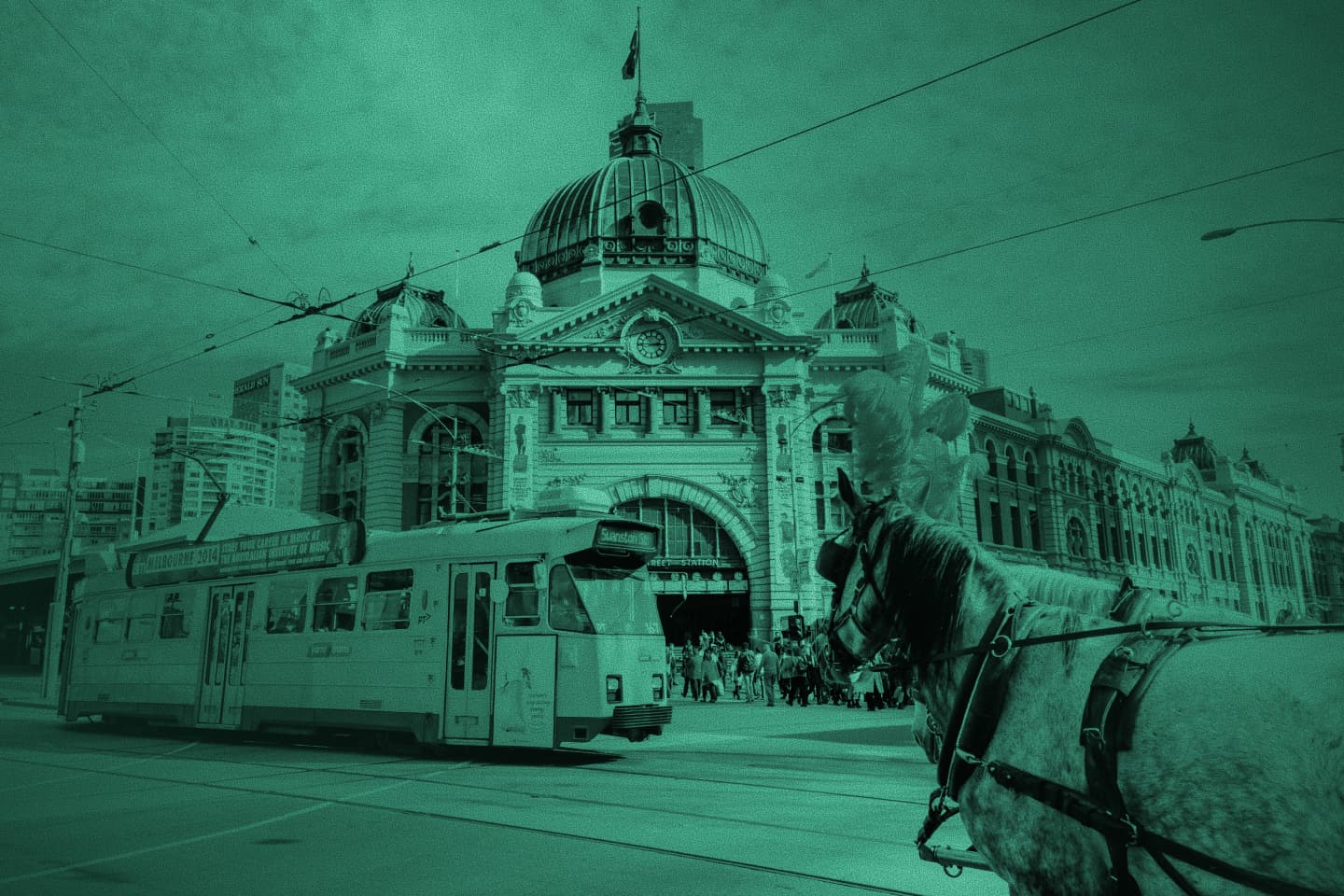 Flinders Street Station in Melbourne with a tram and horse-drawn carriage, green tint